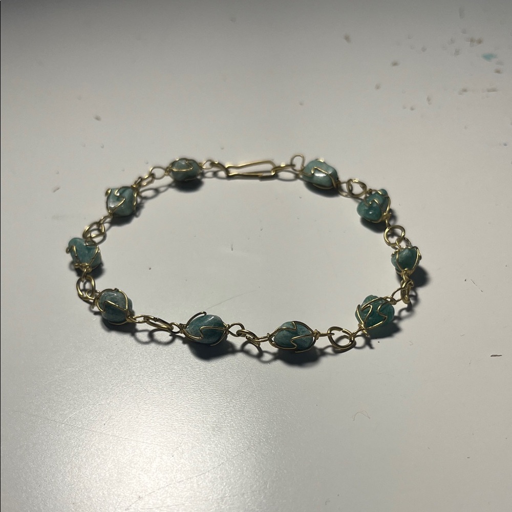 Gold anklet with green natural stones